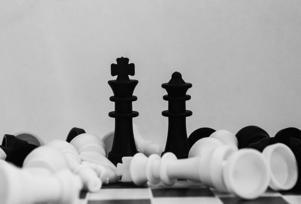 A picture of black and white chess pieces. 