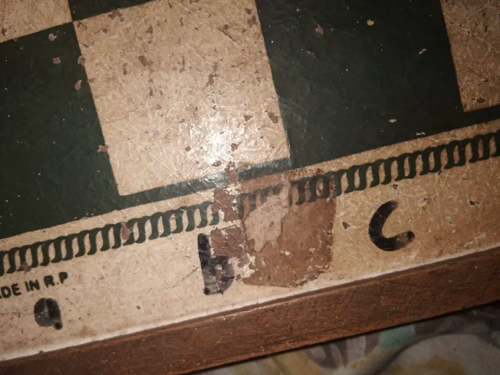 Sticky Dirt on a Wooden Chessboard